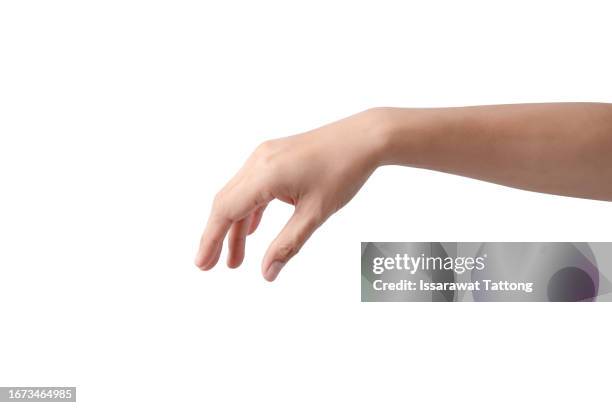 woman reaching out to pick up something.isolated on white background - reiken stockfoto's en -beelden