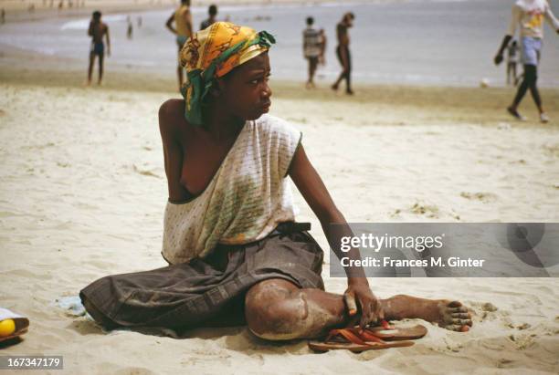 Girl sits on the beach in Freetown, Sierra Leone, February 1985