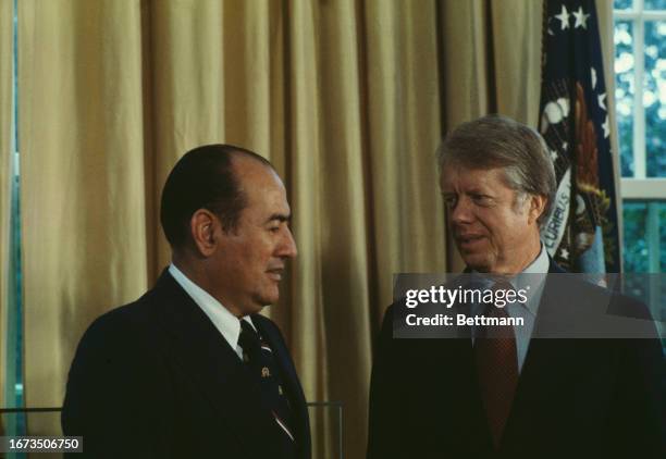 Carlos Humberto Romero , President of El Salvador, talking with US President Jimmy Carter at the Oval Office of the White House in Washington,...