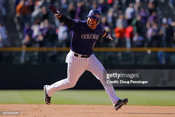 Yorvit Torrealba of the Colorado Rockies celebrates after his game winning RBI single off of Luis Ayala of the Atlanta Braves to score Wilin Rosario...