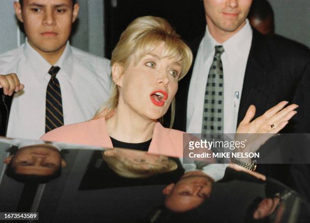 Gennifer Flowers answers reporters' questions following her interview on CNN's Larry King Live show 23 January in Hollywood, CA. According to reports...