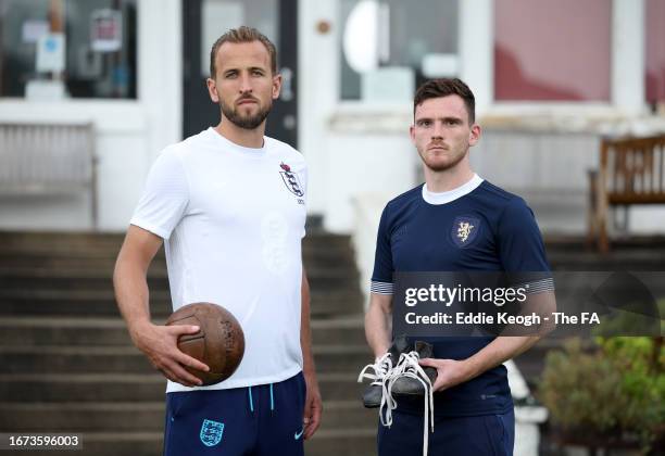 Harry Kane of England and Andy Robertson of Scotland pose for a photo wearing unique warm-up shirts ahead of the 150th Anniversary Heritage Match...