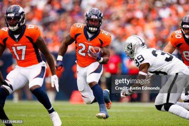 Running back Samaje Perine of the Denver Broncos runs with the football during the first quarter against the Las Vegas Raiders at Empower Field at...
