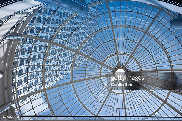 office building seen through glass roof - glass circle stockfoto's en -beelden