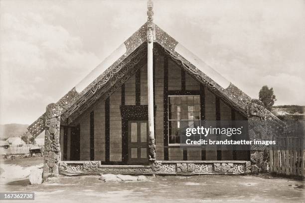 Carvings at he facade of a traditional Maori house. New Zealand. Photograph. About 1885. Schnitzereien an einem Maori Haus. Neuseeland. Photographie....