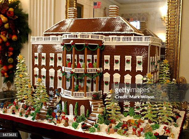 Gingerbreard house made of 80 pounds of gingerbread, 50 pounds of chocolate and 20 pounds of Marzipan, sits in the State Dinning Room of the White...