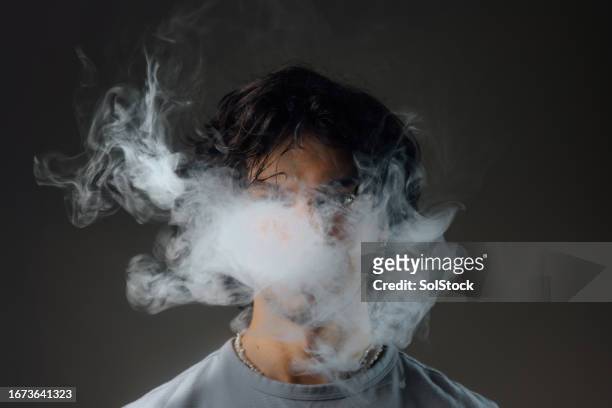 close-up of an electronic cigarette in action - drugs stock pictures, royalty-free photos & images