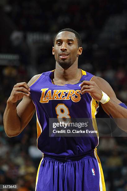 Kobe Bryant of the Los Angeles Lakers pulls his jersey during the NBA game against the San Antonio Spurs at the SBC Center on November 20, 2002 in...