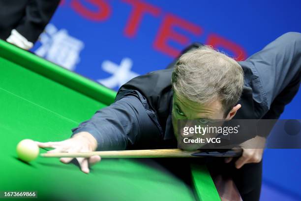 Jack Lisowski of England plays a shot in the first round match against Zhou Yuelong of China on day 1 of World Snooker Shanghai Masters 2023 at...