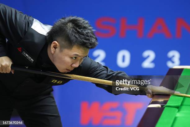 Zhou Yuelong of China plays a shot in the first round match against Jack Lisowski of England on day 1 of World Snooker Shanghai Masters 2023 at...