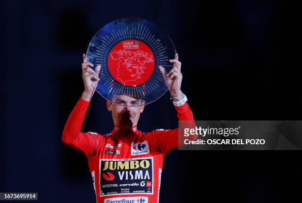 Overall leader Team Jumbo-Visma's US rider Sepp Kuss celebrates on the podium after winning the 2023 La Vuelta cycling tour of Spain, in Madrid, on...