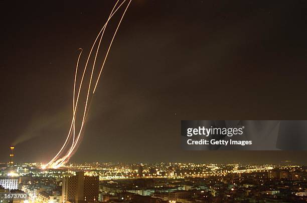 Patriot missiles leave fiery trails in the sky as they are launched against Iraqi Scud missile February 12 over Tel Aviv, Israel. Almost 12 years...