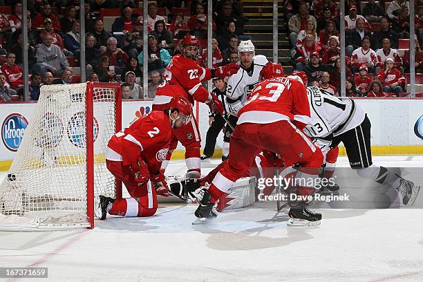 Kyle Clifford of the Los Angeles Kings scores a shot past Jimmy Howard, Kyle Quincy, Joakim Andersson and Brendan Smith of the Detroit Red Wings...