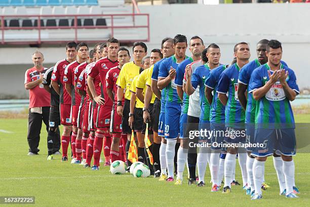 Both teams sing the national anthem of Venezuela before a match between Llaneros de Guanare and Caracas FC as part of the Clausura Tournament 2013 at...