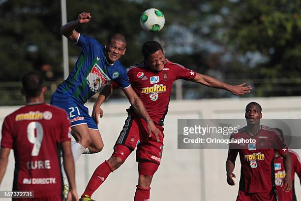 Edwin Peraza of Caracas FC fights for the ball with Leandro Vargas of Llaneros de Guanare during a match between Llaneros de Guanare and Caracas FC...