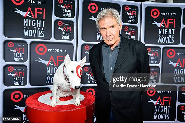 Actor Harrison Ford and Bullseye arrive on the red carpet for Target Presents AFI's Night at the Movies at ArcLight Cinemas on April 24, 2013 in...