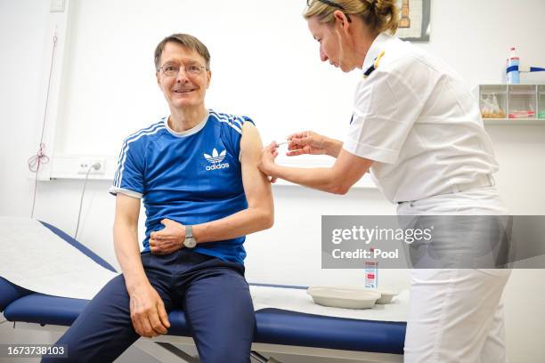 German Health Minister Karl Lauterbach receives a Covid booster vaccine on September 18, 2023 in Berlin, Germany. The German government is...