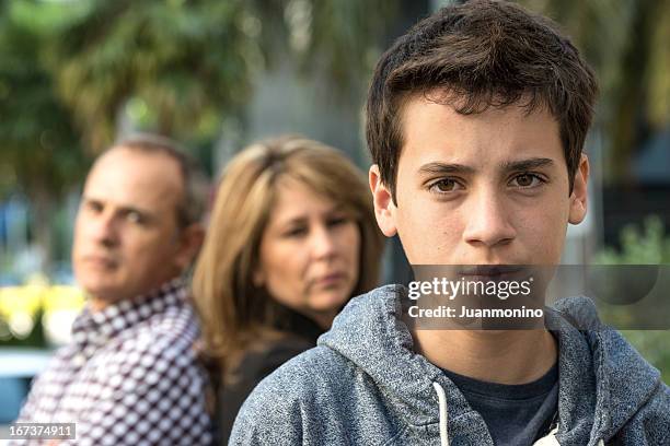 serious teenage boy - family problem stock pictures, royalty-free photos & images