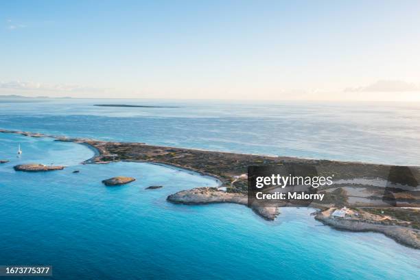 aerial view of the overgrown island formentera and the mediterranean sea - formentera foto e immagini stock