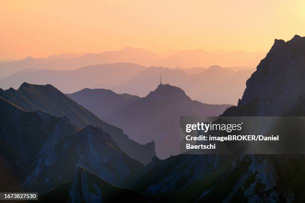 alpstein mountains at sunrise, view of mount hoher kasten, behind it vorarlberg austria, canton appenzell innerrhoden, switzerland - appenzell innerrhoden stock pictures, royalty-free photos & images