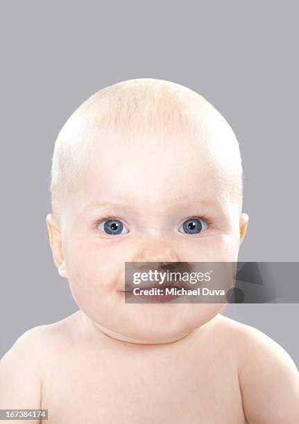 studio shot of a baby laughing on gray background - michael virtue stock pictures, royalty-free photos & images