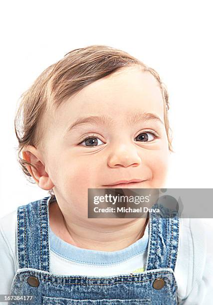 boy on white background holding laugh back - michael virtue stock pictures, royalty-free photos & images
