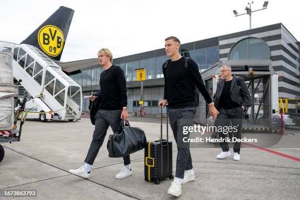 Julian Brandt and Nico Schlotterbeck of Borussia Dortmund at the airport ahead of their UEFA Champions League group match against Paris Saint-Germain...