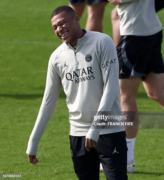 Paris Saint-Germain's French forward Kylian Mbappe takes part a training session at Poissy, west of Paris on September 18 on the eve of their UEFA...