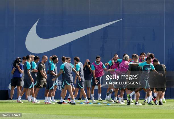 Barcelona's players attend a training session ahead of the UEFA Champions League football match between FC Barcelona and Royal Antwerp FC, at the...