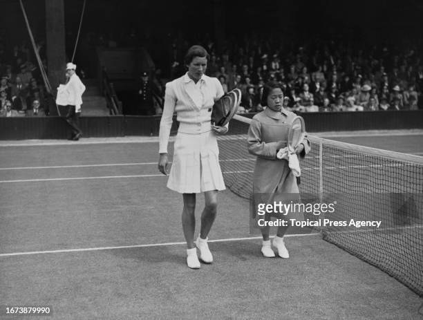 Tennis players Hilde Sperling and Gem Hoahing arriving at court for their Women's singles match at the Wimbledon Championships, London, 27th June...