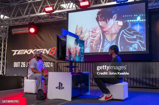 Gamers play Tekken 8 on PlayStation 5 with the character Jin displayed on screen during the Insomnia Gaming Festival #I71 at NEC Arena on September...