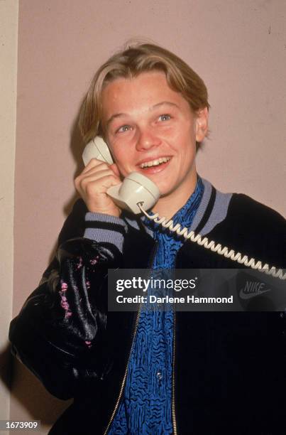 American actor Leonardo DiCaprio talks on the telephone, circa 1989.