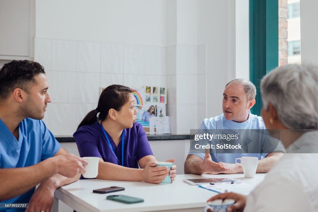Coworkers Chatting About Weekend Plans