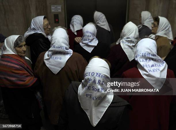 Members of Madres de Plaza de Mayo human rights organization, wait for the elevator at the at the Argentina's Defense Ministry, to attend the Union...