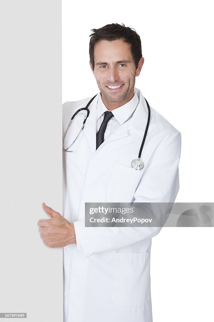 Doctor presenting empty banner