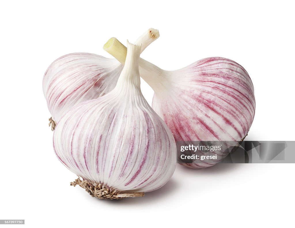 Heads of garlic on a white background