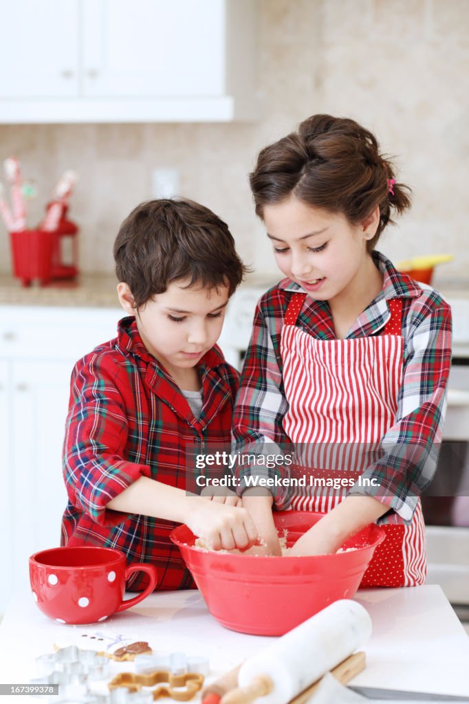 Kids baking sugar cookies