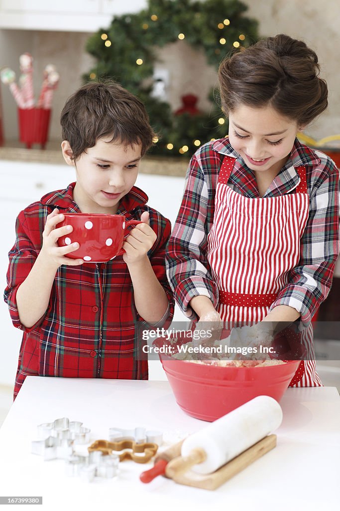 Kids baking sugar cookies