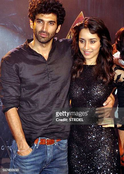 Indian Bollywood personalities Aditya Roy Kapoor and Shraddha Kapoor pose during a promotional event for the Hindi film "Aashiqui 2" in Mumbai on...