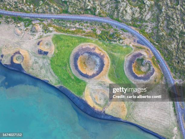 aerial vertical view of old volcano and ashpalt road, near to myvatn lake during a summer day, iceland, europe - berg mount vindbelgur stock-fotos und bilder