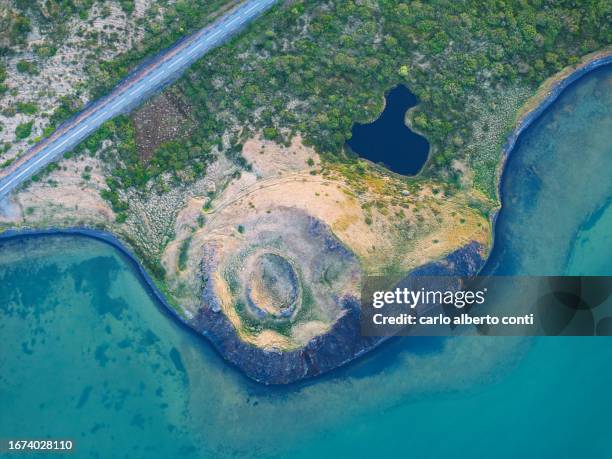 aerial vertical view of old volcano and ashpalt road, near to myvatn lake during a summer day, iceland, europe - berg mount vindbelgur stock-fotos und bilder