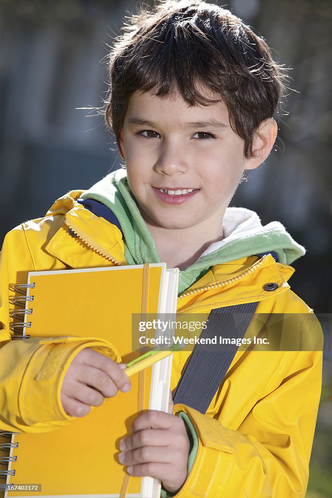 Student with yellow book