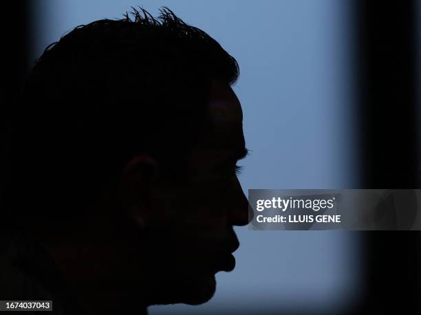 The profile of Barcelona's Spanish coach Xavi is pictured during a press conference on the eve of the UEFA Champions League football match between FC...