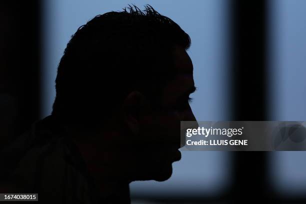 The profile of Barcelona's Spanish coach Xavi is pictured during a press conference on the eve of the UEFA Champions League football match between FC...