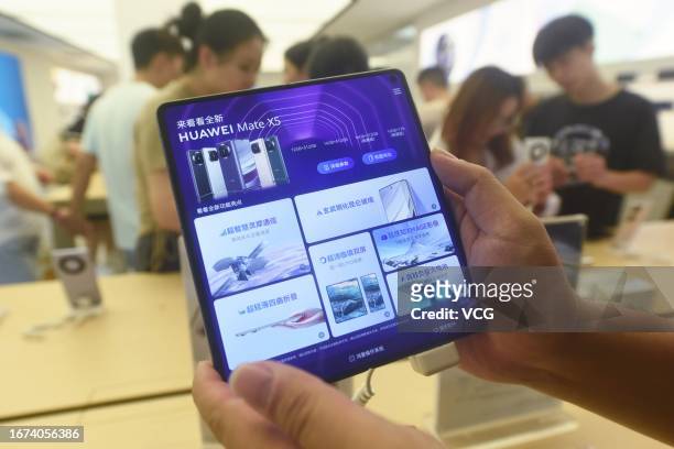 Huawei Mate X5 foldable smartphone is displayed for sale at a Huawei store on September 11, 2023 in Hangzhou, Zhejiang Province of China.
