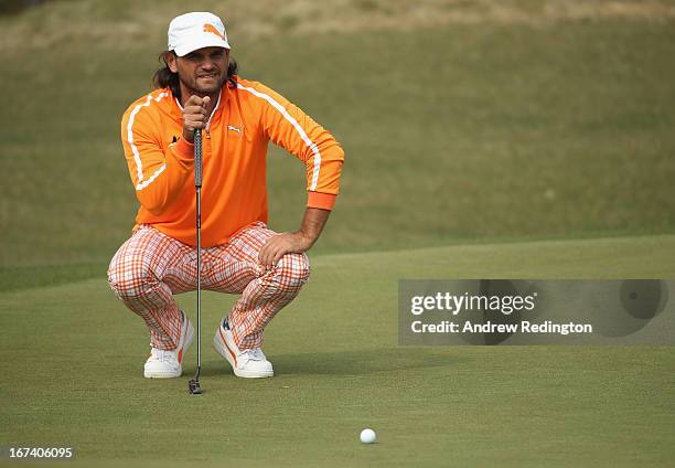 Johan Edfors of Sweden lines up a putt on the 18th hole during the first round of the Ballantine's Championship at Blackstone Golf Club on April 25,...