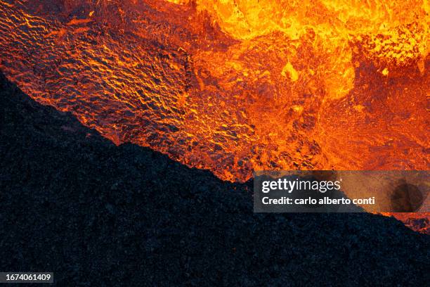 aerial view taken by airplane of litli-hrutur volcano during eruption, reykjanes peninsula, iceland, europe - lava stock pictures, royalty-free photos & images