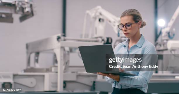 engineer, woman and robotics, laptop and programming of robot arm with machine learning and high tech. innovation, future technology and engineering, industrial workshop and automation with software - artificial intelligence models stock pictures, royalty-free photos & images