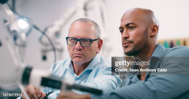 men, lab and planning for robotics science, engineering or futuristic development with ideas for electronics. machine learning, scientist and teamwork for thinking, arm and automation with creativity - metallic look stock pictures, royalty-free photos & images