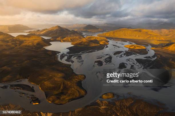aerial view taken by drone of beautiful warm sunset in landmannaugar area during a summer day, iceland, europe - central iceland stock pictures, royalty-free photos & images